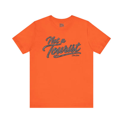 Knox Nixon NOT A TOURIST Dark script graphic T-shirt in orange