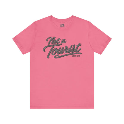 Knox Nixon NOT A TOURIST Dark script graphic T-shirt in pink
