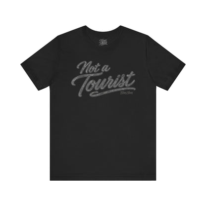 Knox Nixon NOT A TOURIST Dark vintage script T-shirt in black