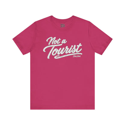 Knox Nixon NOT A TOURIST script graphic T-shirt in pink