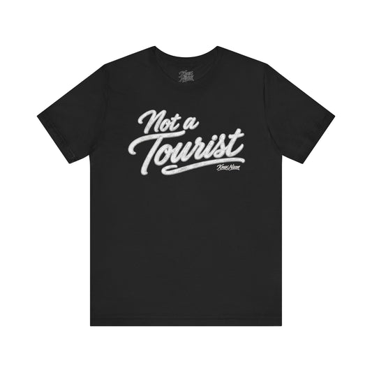 Knox Nixon NOT A TOURIST vintage script graphic T-shirt in black