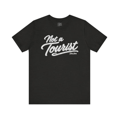Knox Nixon NOT A TOURIST vintage script graphic T-shirt in black heather